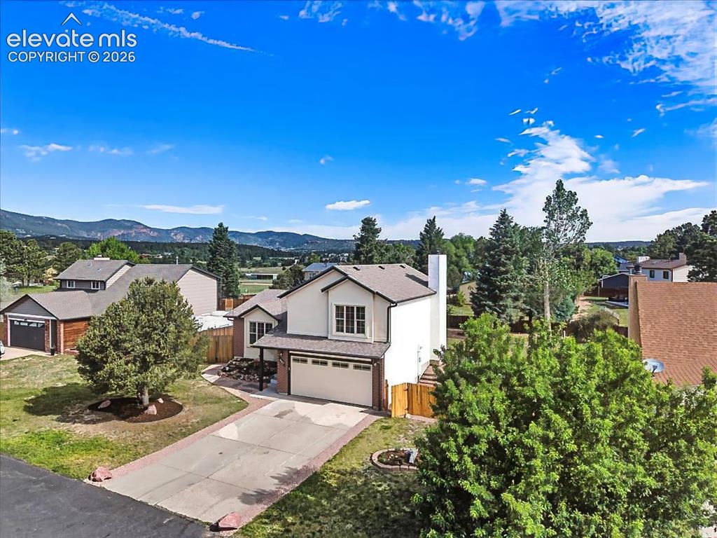 Image 2 of 50: Welcome home to this charming Monument property offering mature trees, esta