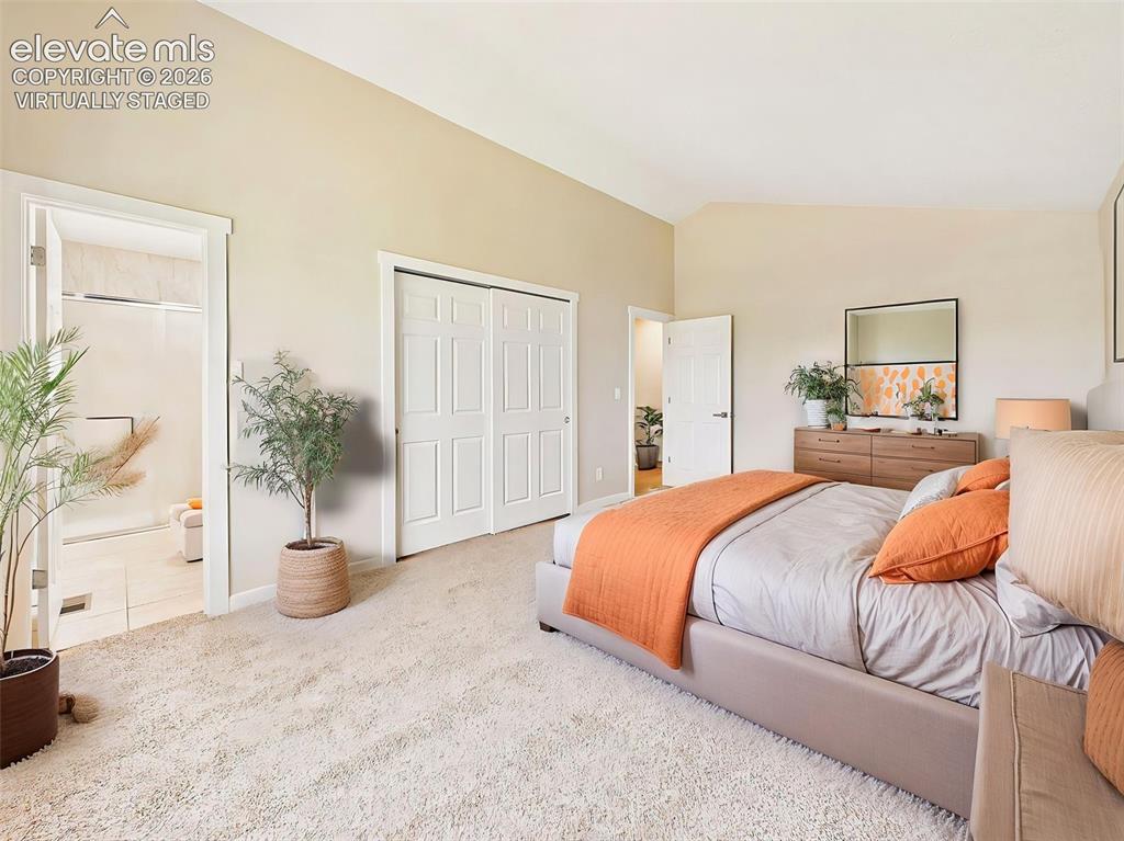 Image 28 of 50: (Virtually Staged) Large primary suite with vaulted ceilings, en-suite bath