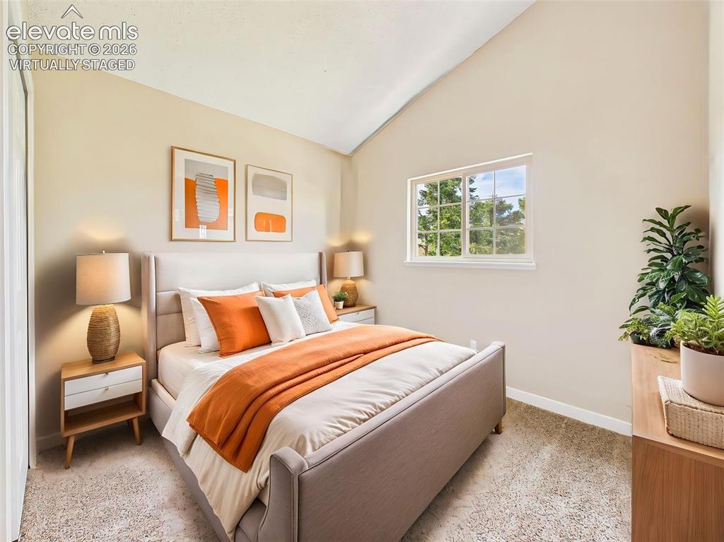 Image 33 of 50: (Virtually Staged) Spacious secondary bedroom with vaulted ceilings, new ca