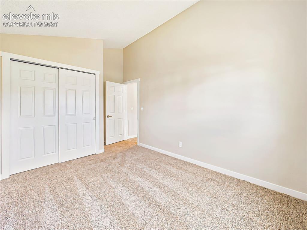 Image 34 of 50: This bright and versatile bedroom offers soaring vaulted ceilings, fresh ne