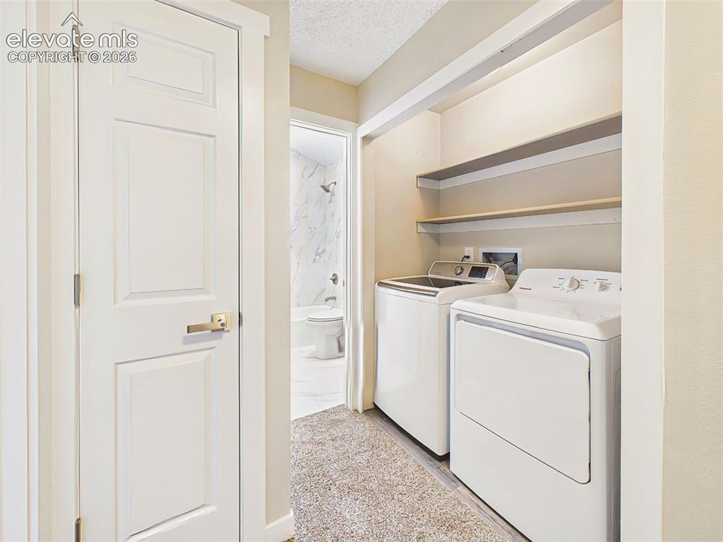 Image 35 of 50: Enjoy the convenience of an upstairs laundry area complete with washer and