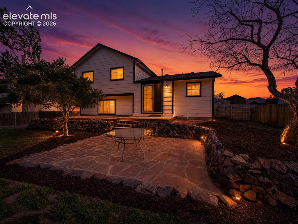 Image 39 of 50: Step outside to a beautifully designed backyard oasis showcasing a large fl