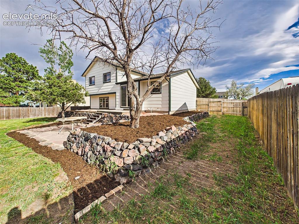 Image 42 of 50: Hard-to-find RV and camper parking complements this spacious, fully fenced