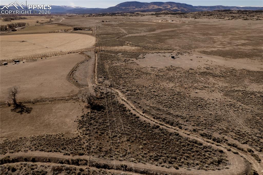 Image 12 of 16: Overview of rural landscape featuring a desert landscape and a mountainous 