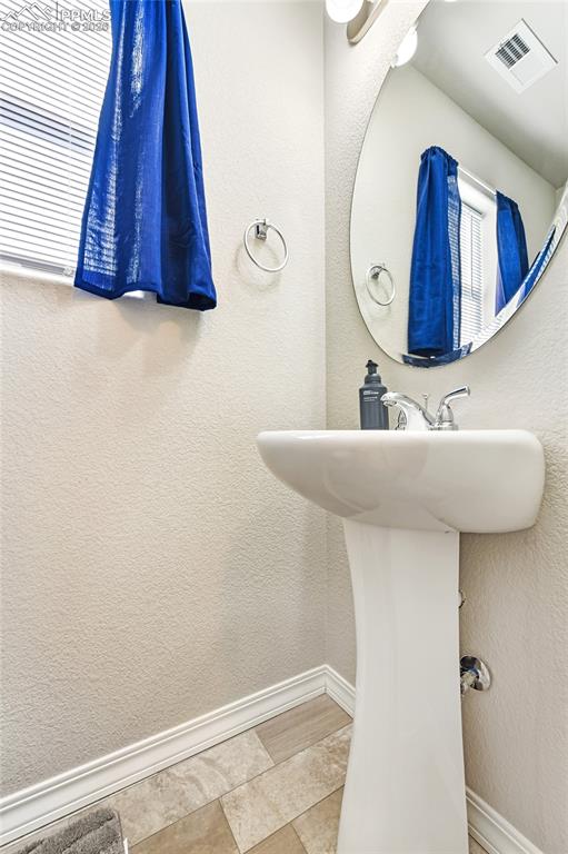 Image 27 of 38: Half bath on main level