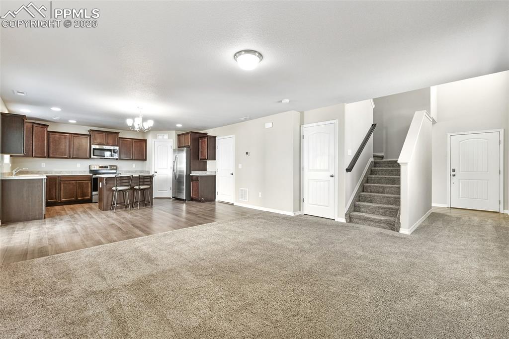 Image 7 of 38: Entry, Livingroom, dining and Kitchen