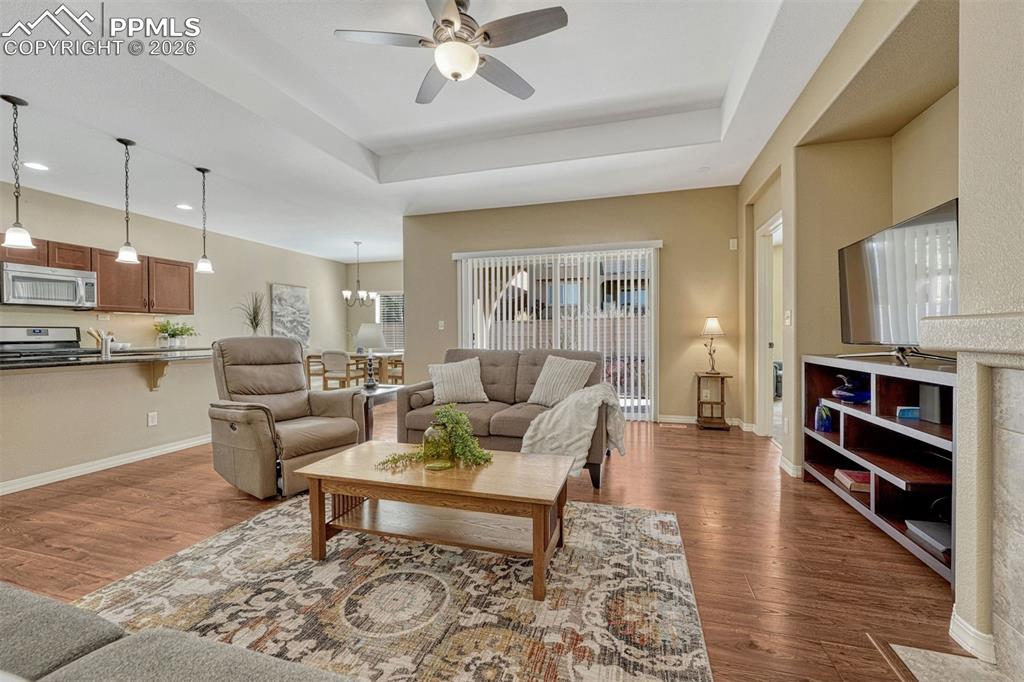 Image 12 of 41: Relax, entertain, and enjoy the outdoors — living room opens directly to th