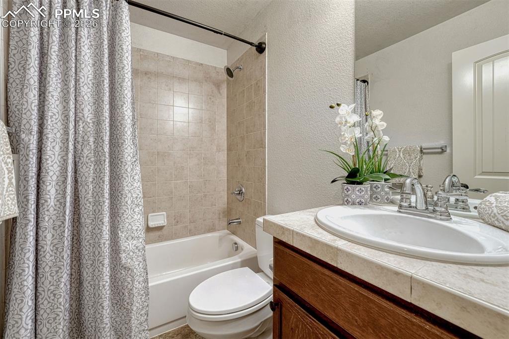 Image 14 of 41: Bright and comfortable secondary bath — practical, stylish, and ready for f