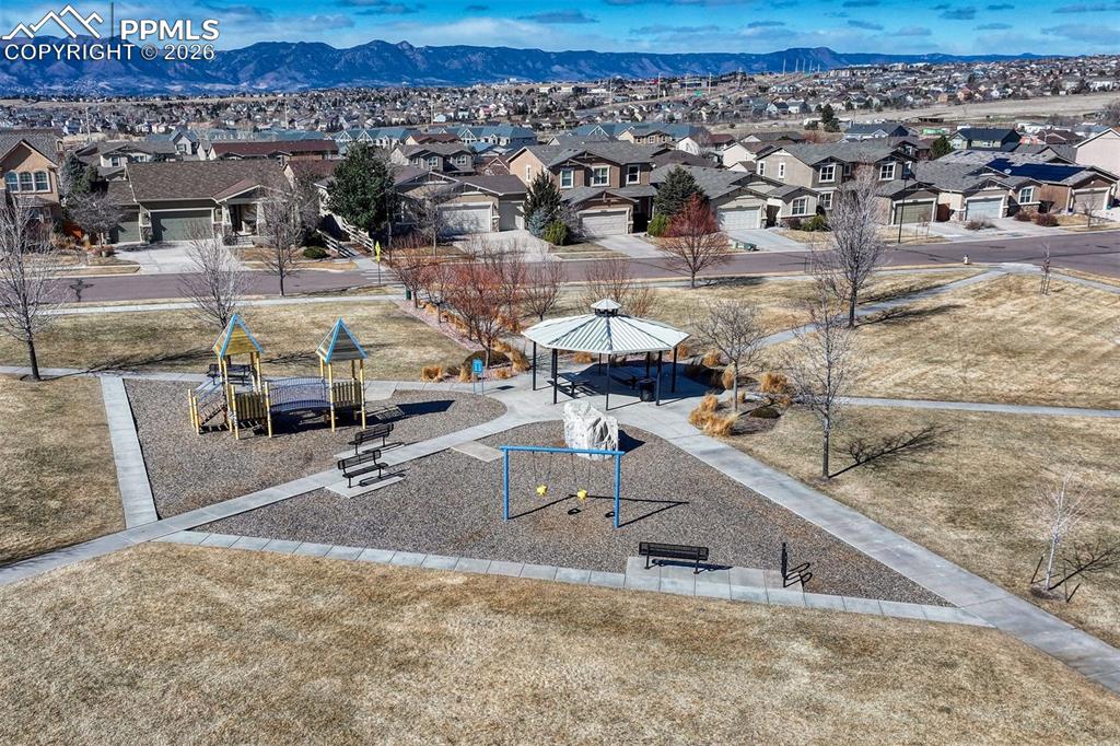 Image 18 of 41: Outdoor fun and community gatherings just steps away at Cumbre Vista Park.