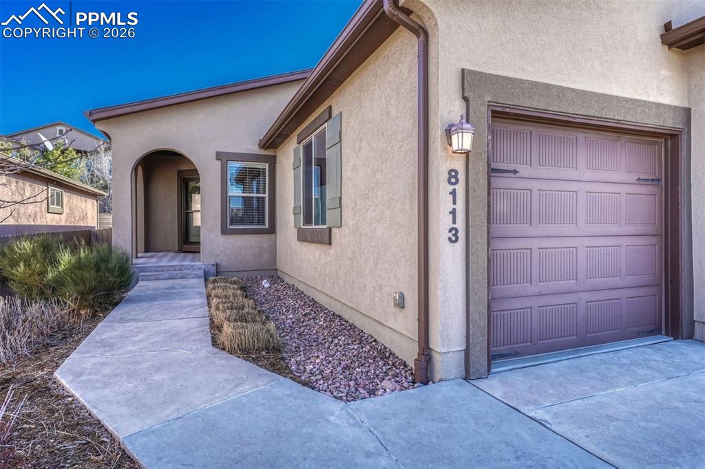 Image 2 of 41: Enjoy the convenience of an insulated 3 car garage and front yard maintenan