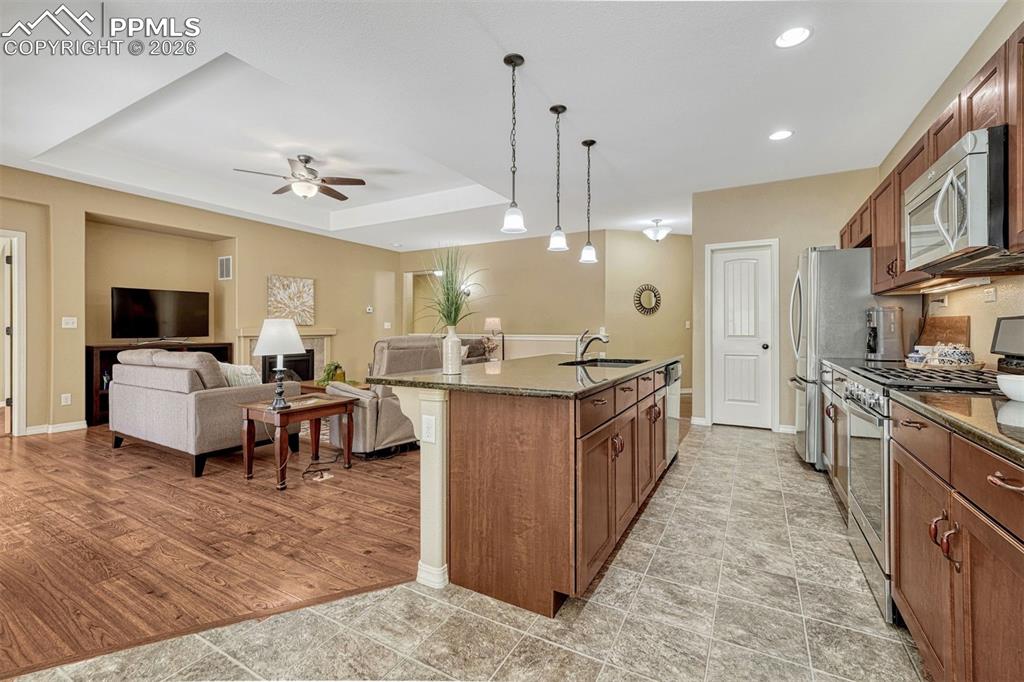 Image 21 of 41: Cook, entertain, and create — granite countertops, stainless appliances, an