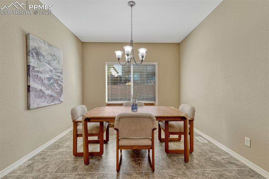 Image 22 of 41:
Open dining area adjacent to the kitchen — perfect for family meals or ent