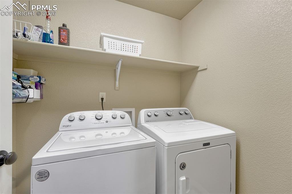 Image 23 of 41: Dedicated laundry space designed for efficiency and convenience.