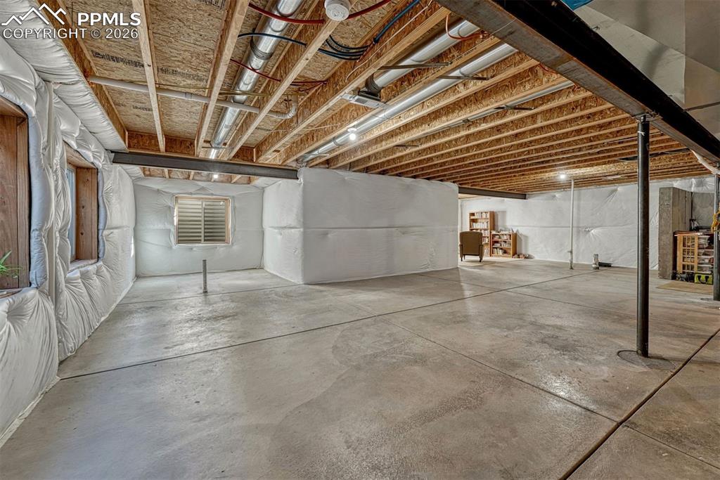 Image 25 of 41: Endless possibilities await — this unfinished basement is ready for a home