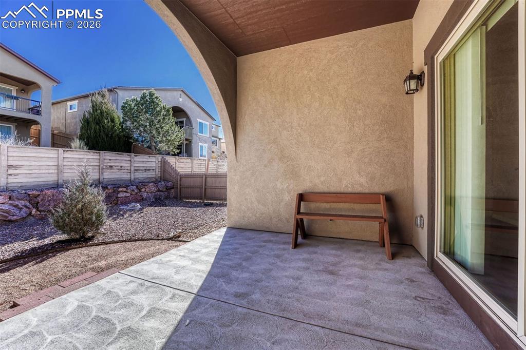 Image 27 of 41: Low-maintenance, fenced backyard — your outdoor retreat await.