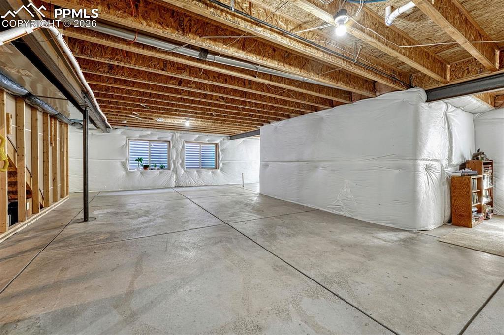 Image 29 of 41: Flexible lower level with plumbing in place — perfect for recreation, addit