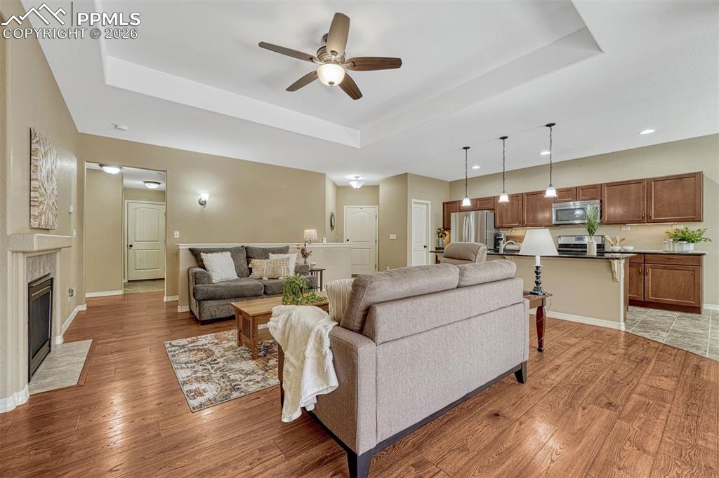Image 3 of 41: Gather, relax, and unwind — living room with gas fireplace, elegant trey ce