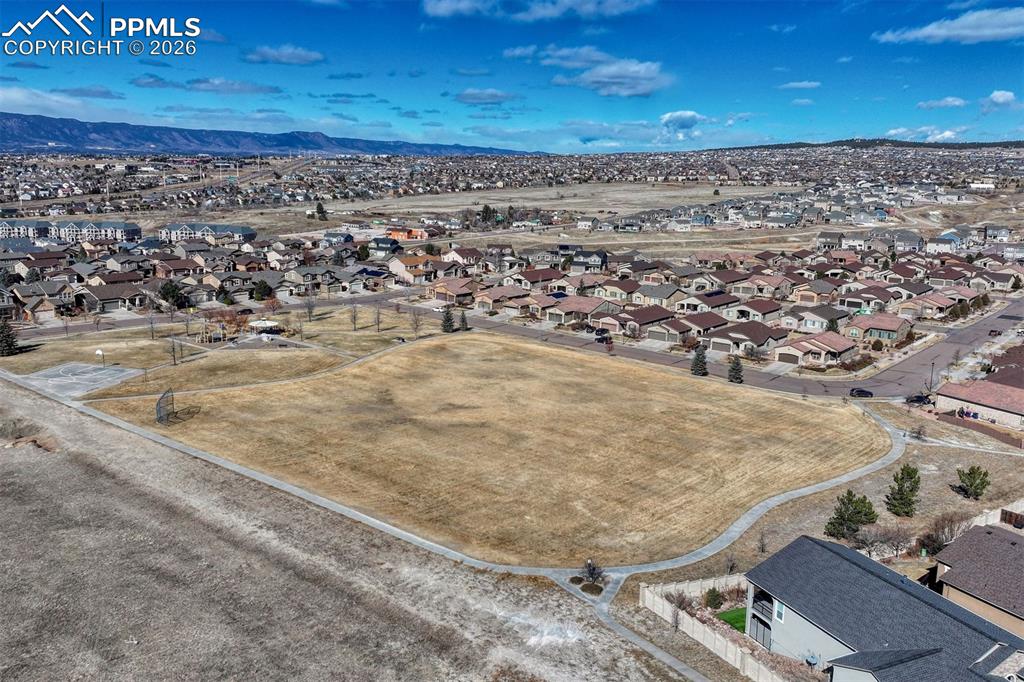 Image 32 of 41: Just down the street — Cumbre Vista Park offers playgrounds, ball fields, a