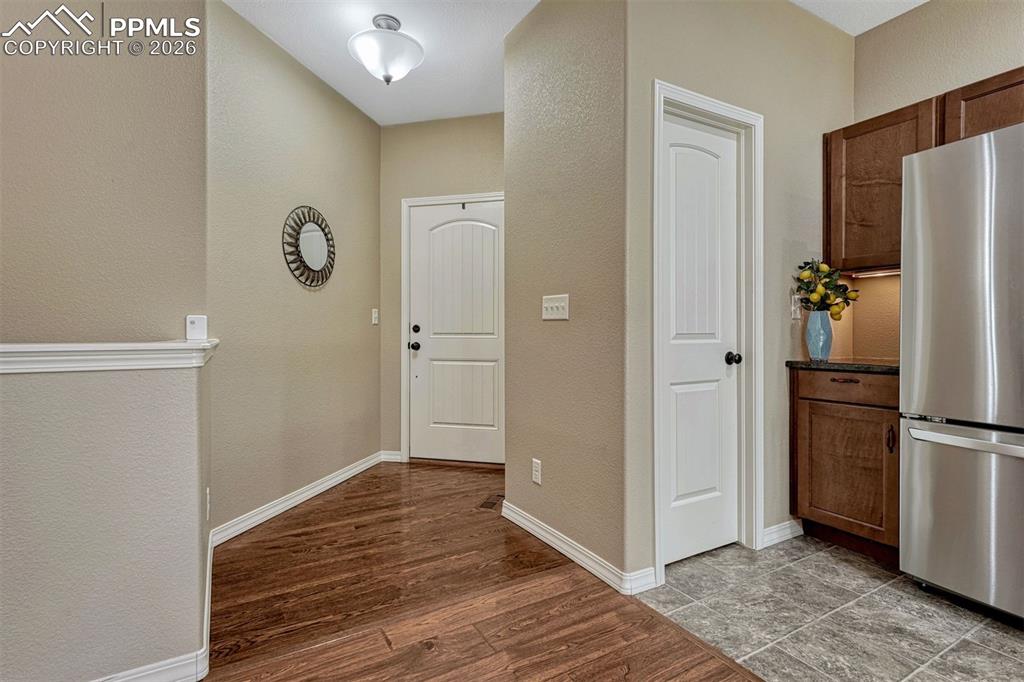 Image 34 of 41: Welcome home — durable luxury vinyl plank floors flow seamlessly from the e