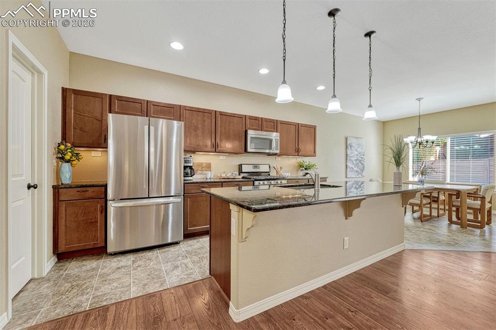 Image 4 of 41: Cook, entertain, and create — granite countertops, stainless appliances, an