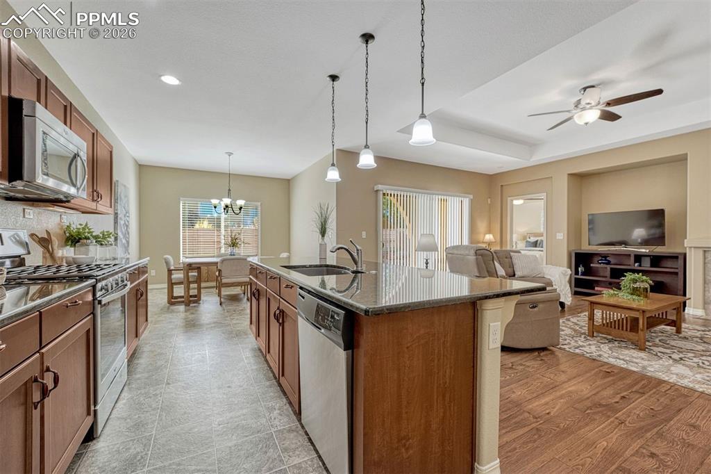 Image 6 of 41: Functional and stylish — granite counters, stainless appliances, and a gene