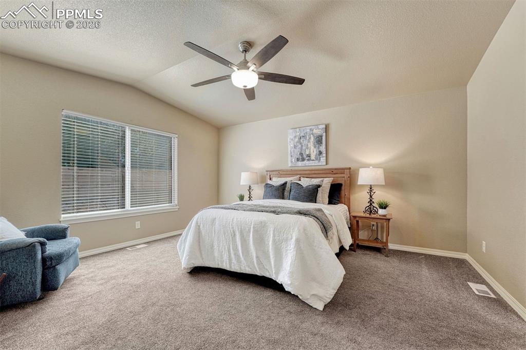 Image 8 of 41: Spacious primary suite with walk-in closet and private bath — your relaxing