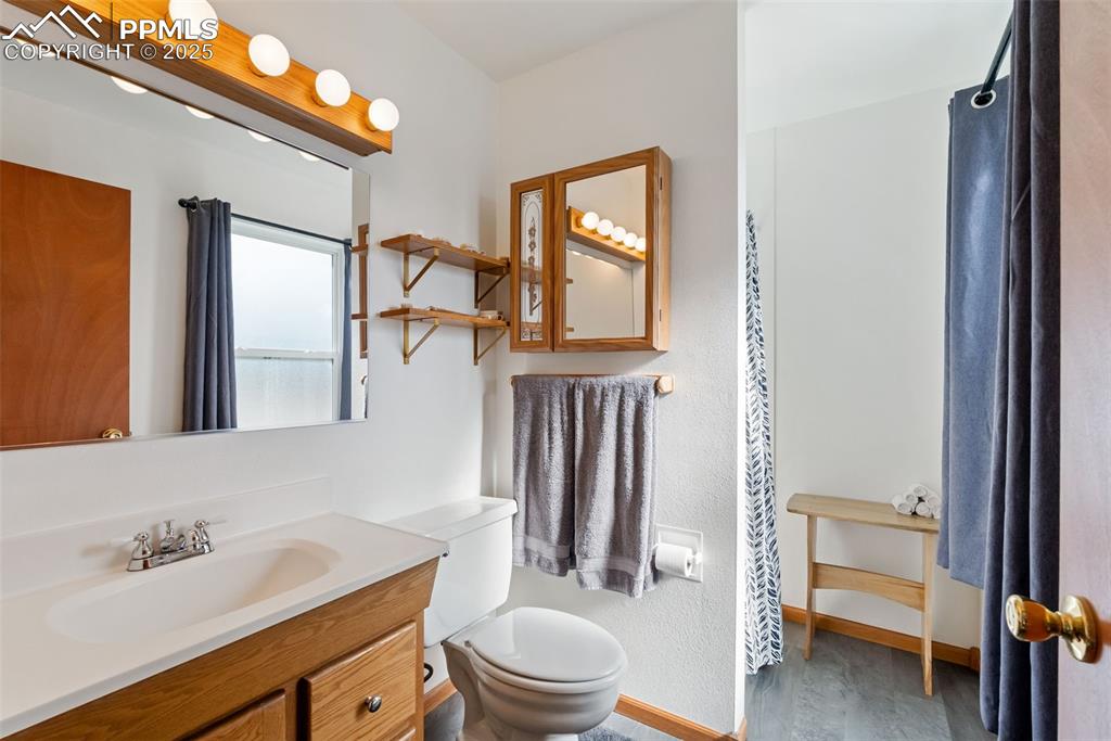 Image 20 of 42: The primary bathroom has the same luxury vinyl flooring and a free standing