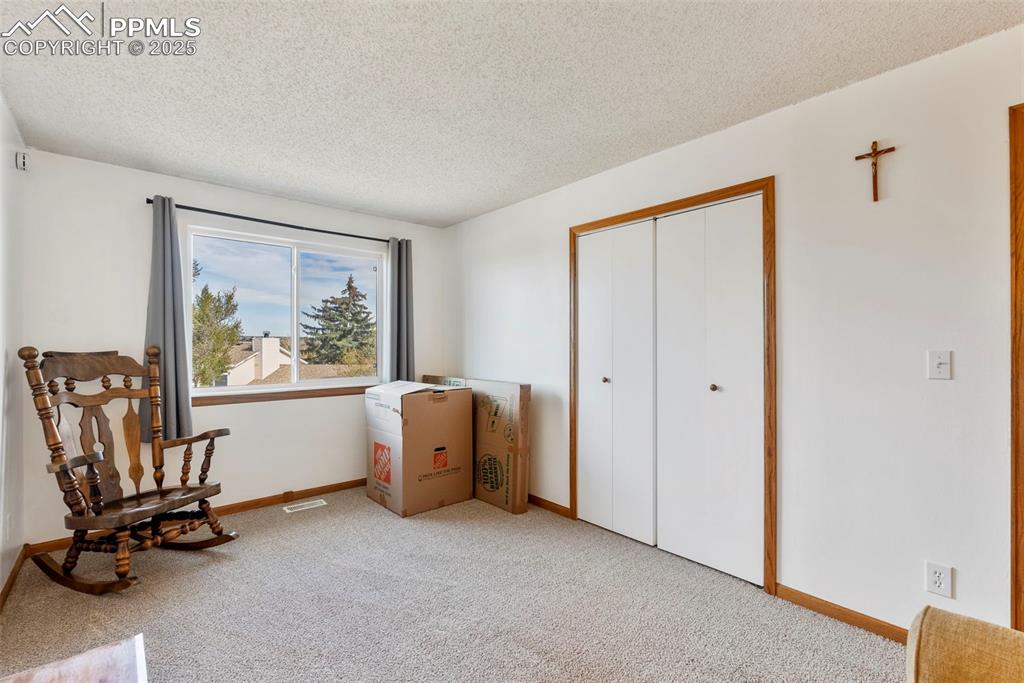 Image 21 of 42: Second upper level bedroom with new carpet