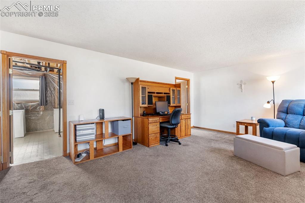 Image 30 of 42: One door leads to a non-conforming bedroom and utility/laundry room.