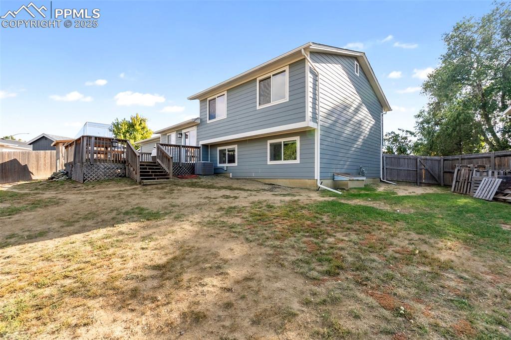 Image 39 of 42: The majority of the quarter acre lot is in the backyard with the house loca