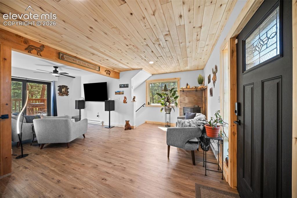Image 11 of 42: Main level sitting area and living room