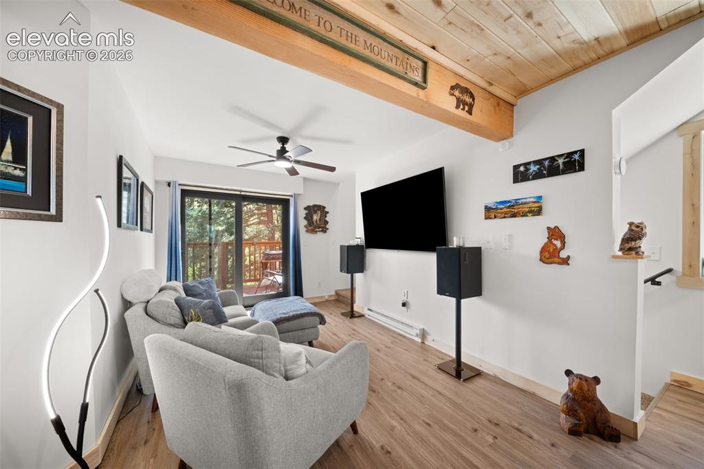 Image 14 of 42: Main leve living area with walk out to deck