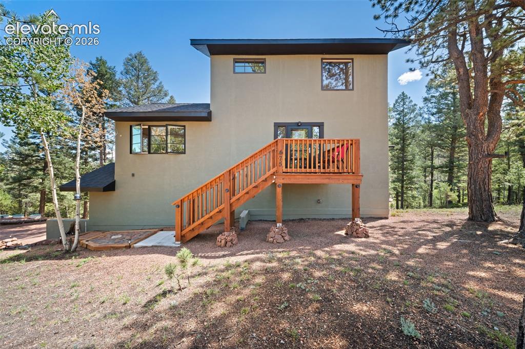 Image 2 of 42: Front of home with entry to main level