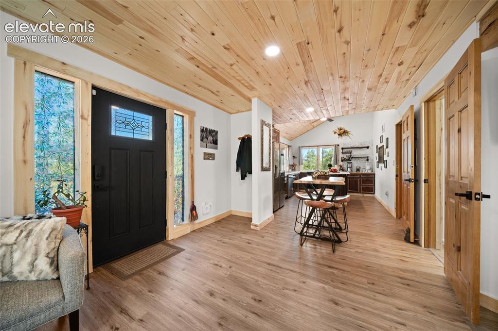 Image 6 of 42: Main level of entry, dining and kitchen