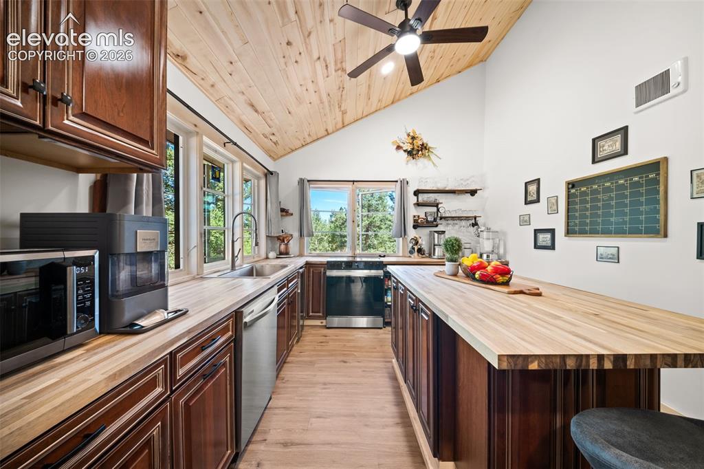 Image 7 of 42: Main level kitchen with island