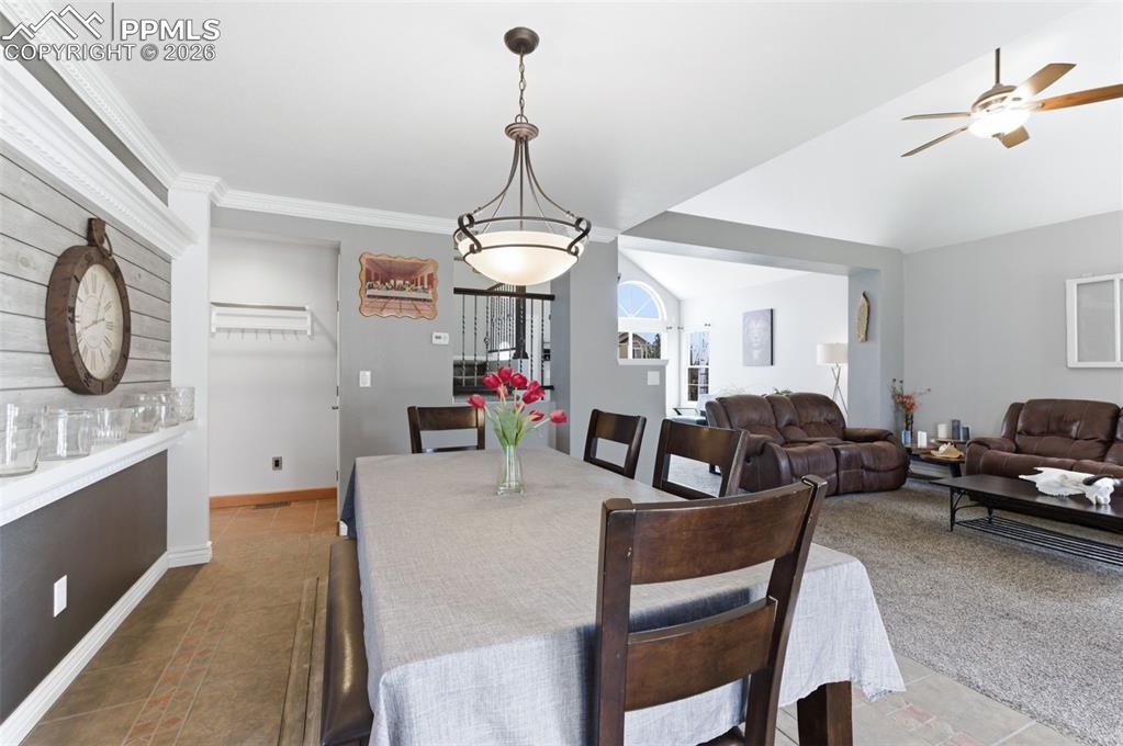 Image 10 of 44: Elegant lighting fixtures, beautiful tile flooring, and a decorative accent