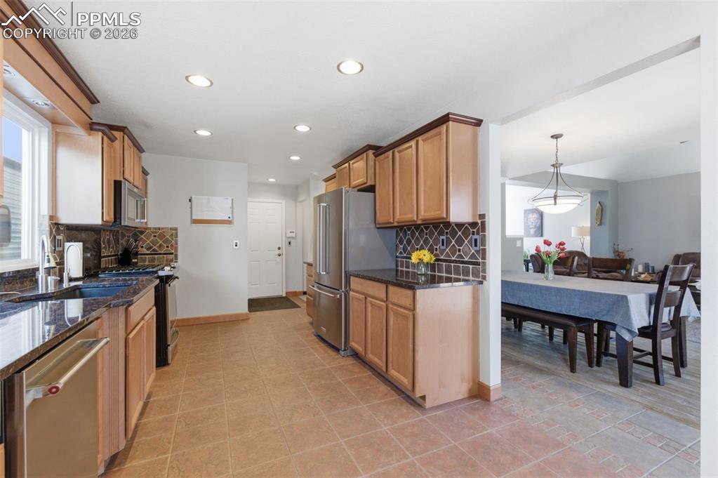 Image 12 of 44: Convenient yet discrete access to the garage through the kitchen