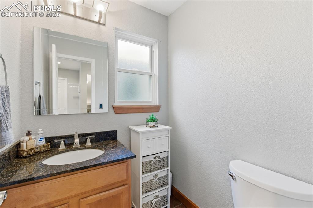 Image 15 of 44: A powder bath on the main level is convenient yet discrete.