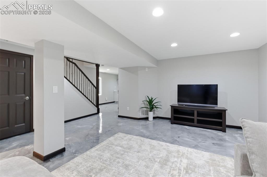 Image 31 of 44: Open stairway; recessed lighting; newer carpet - it