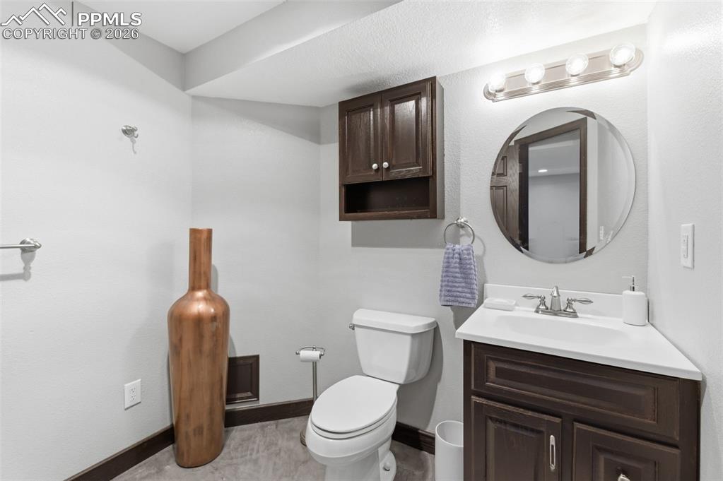 Image 34 of 44: The basement level full bath is spacious and warm