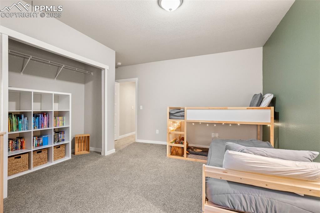 Image 25 of 48: Carpeted bedroom with baseboards and a closet