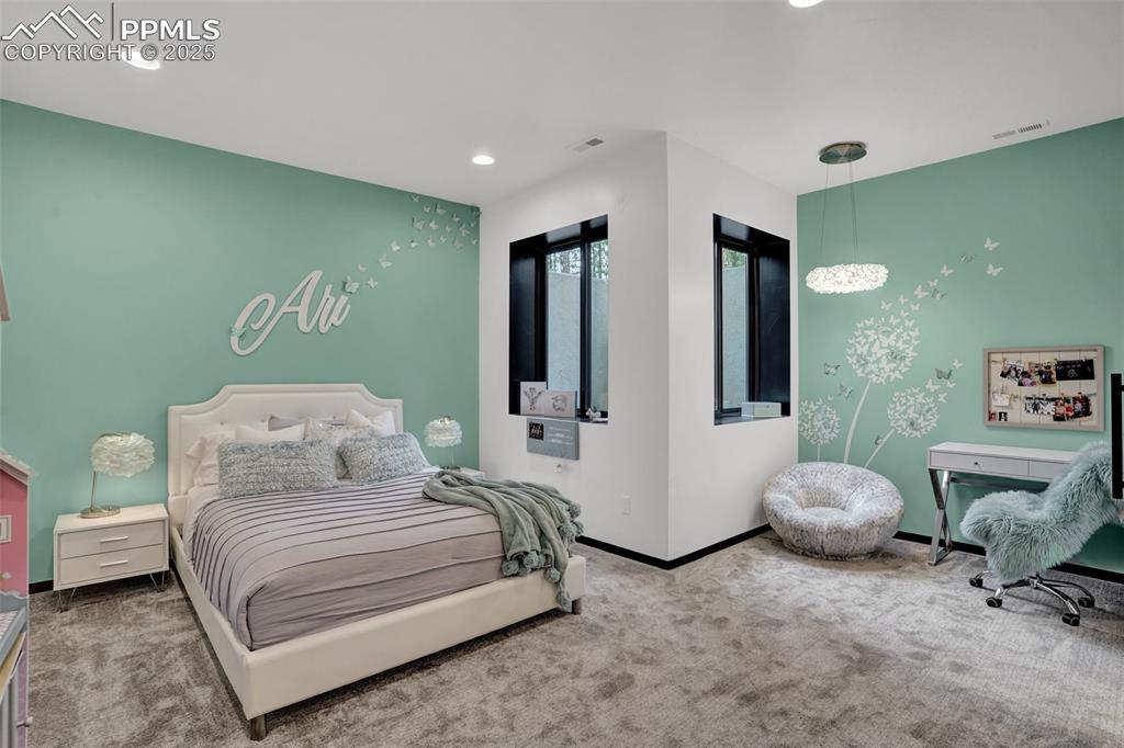 Image 17 of 36: Ensuite Bedroom #2 with private bath, walk in closet and built-in shleving
