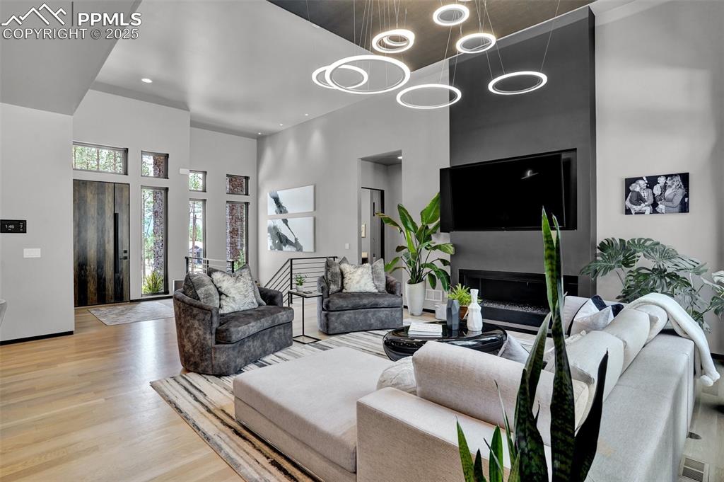 Image 5 of 36: Note the custom lighting fixture(s) and ceiling details.