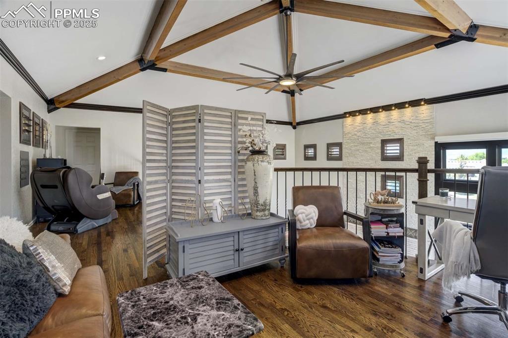 Image 19 of 50: Office area with wood finished floors