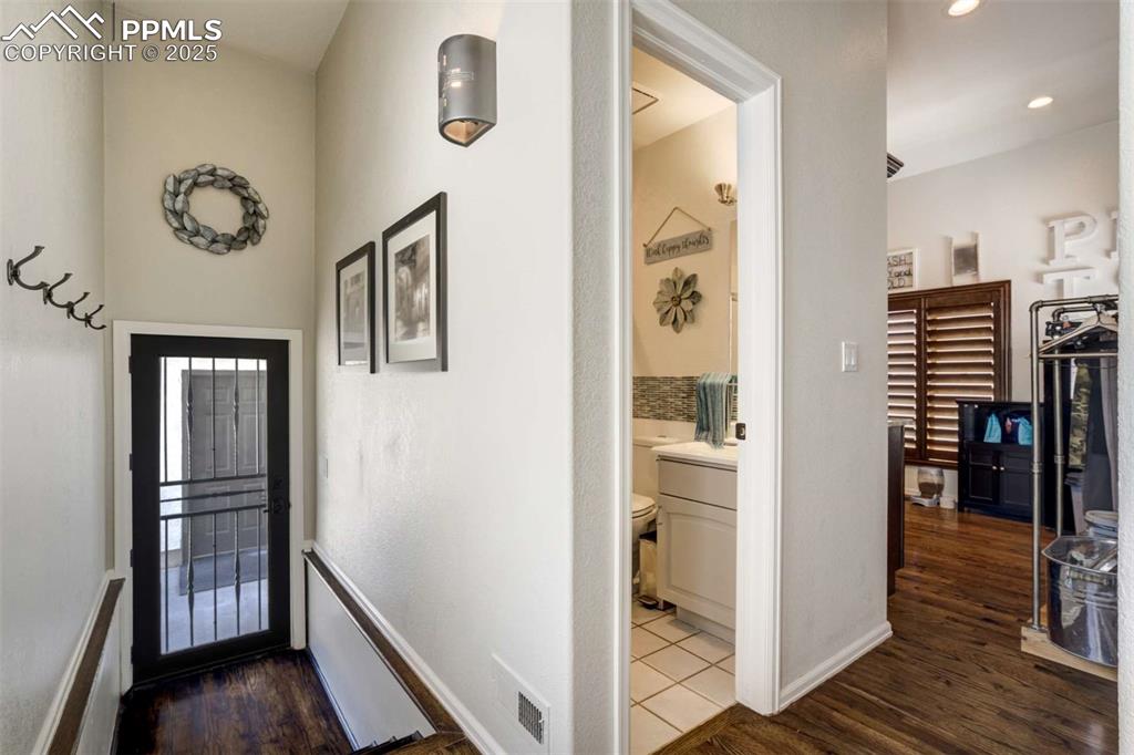 Image 29 of 50: Foyer featuring dark wood-type flooring and recessed lighting