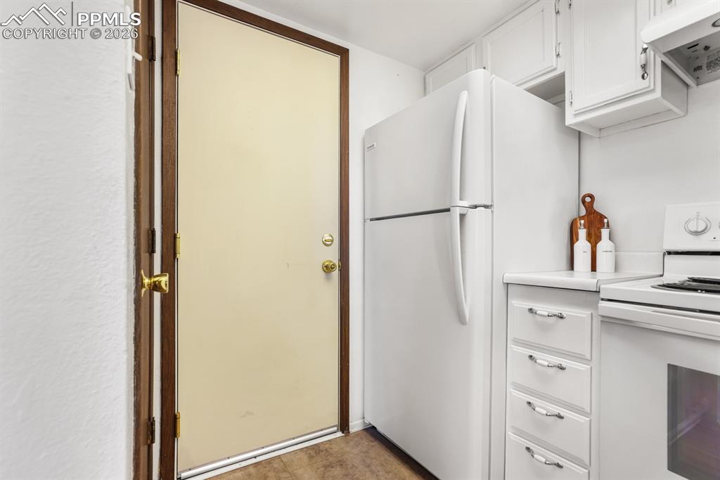 Image 11 of 28: Garage access from the Kitchen.