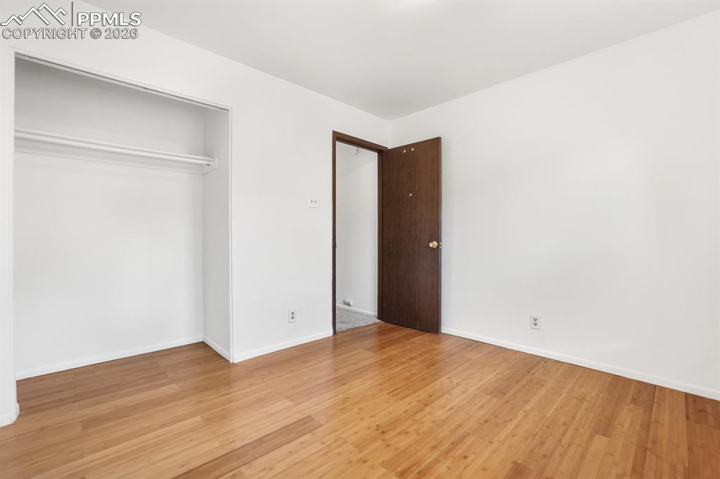 Image 22 of 28: Upper Level Bedroom #2 with generous closet.