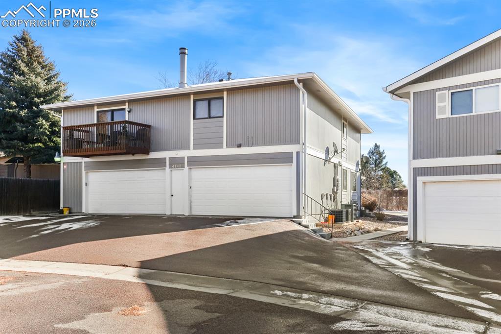 Image 27 of 28: Attached shared garage in the back of the unit.