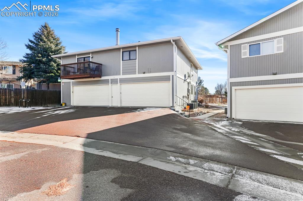 Image 28 of 28: Attached shared garage in the back of the unit.