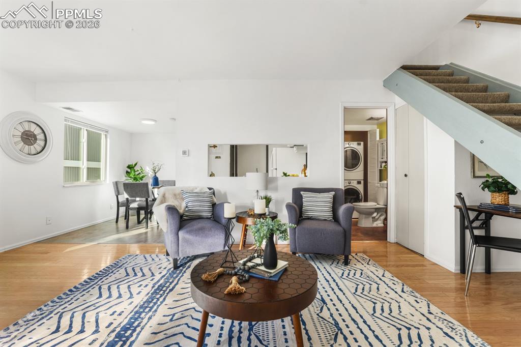 Image 6 of 28: View of the Dining Room and Powder Bathroom/Laundry located off the Living 